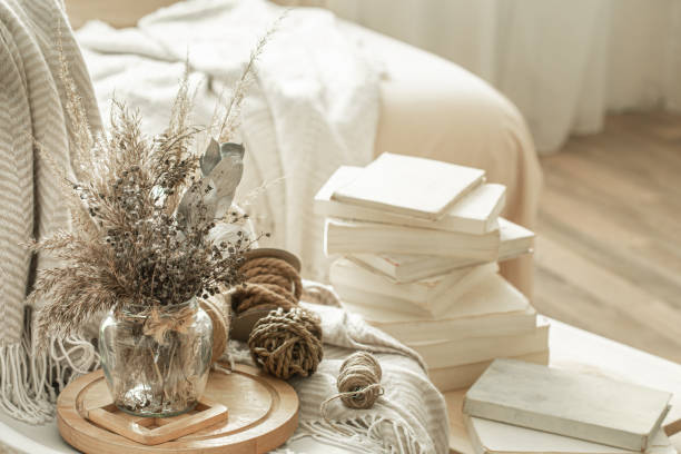 istock Home interior with books and dried flowers. 1214132221