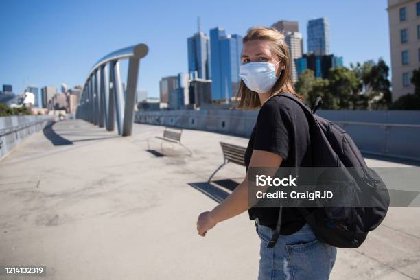 Woman Wearing Face Mask Walking To Melbourne City Stock Photo - Download Image Now - Melbourne - Australia, Australia, Protective Face Mask