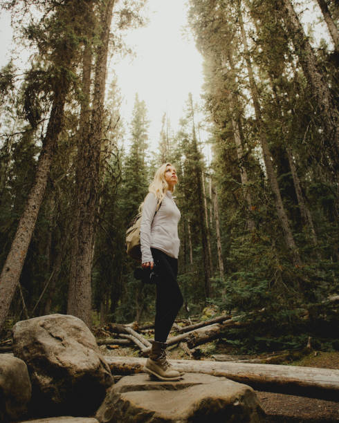 Woman standing strong in a forest