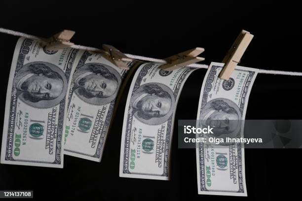 Onehundred Dollar Bills Are Hung With Clothespins On A String On A Black Background Concept Of Dirty Money Dollar Is Falling Stock Photo - Download Image Now