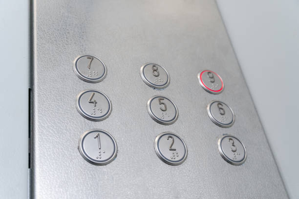 istock Elevator buttons with Braille, the system highlights the button for the 9th floor 1214137131