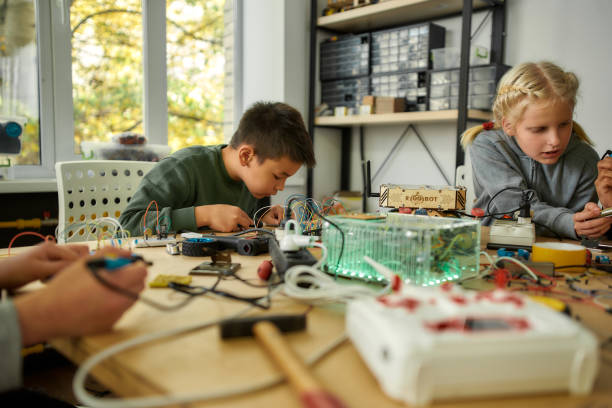 istock You dream it, I make it. Young engineer using soldering iron to join chips and wires. Robotics and software engineering for elementary students. Inventions and creativity for kids 1214137279