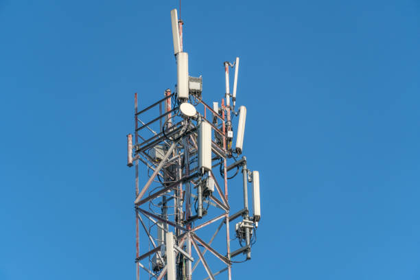 istock Mobile communication tower close-up against the blue sky 1214137450