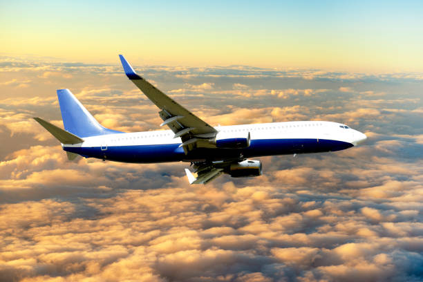 istock Passenger airplane flying over the clouds 1214138315