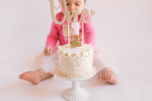 A baby girl's first birthday cake. Cake smash.