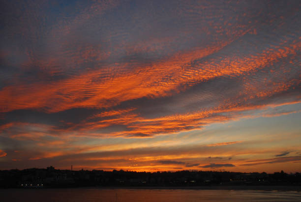 Beautiful red gradient sunset of bondi Beach. The sweeping white-sand crescent of Bondi is one of Australia’s most iconic beaches during sunset time. bondi beach sunrise stock pictures, royalty-free photos & images