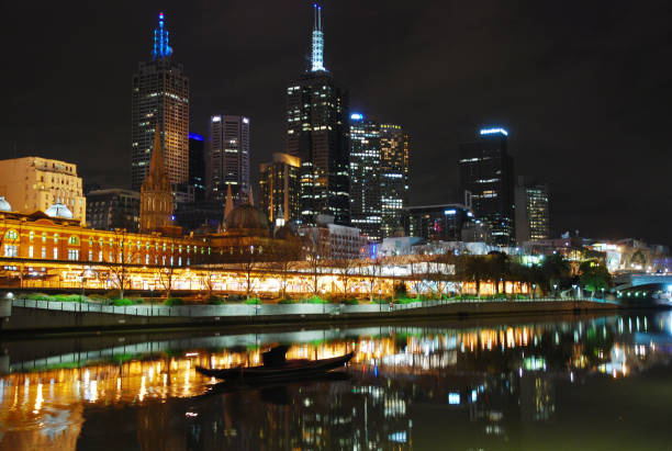 istock Reflection of mlbourne city's skyline on yarra river during night time. 1214140516