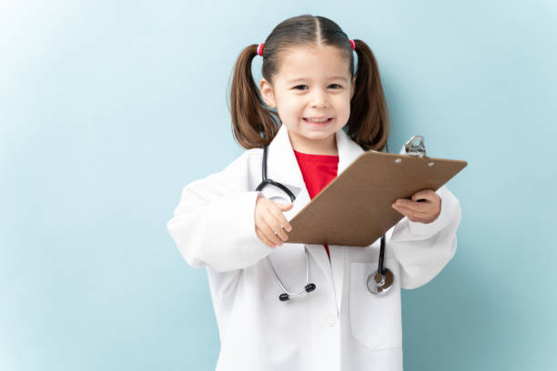 Pretty little doctor in a studio