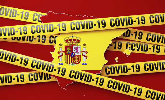Spain map surrounded by COVID-19 imprinted tape barriers on red background. Horizontal composition with copy space. COVID-19 quarantine and pandemic concept.