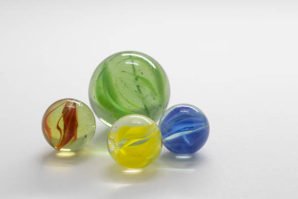 Colourful toy marbles against a white background