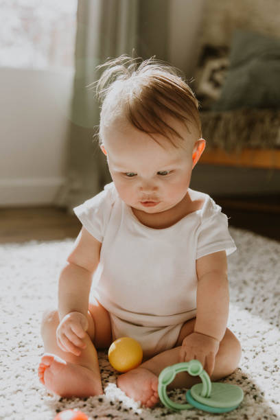 istock Baby playing at home 1214145234