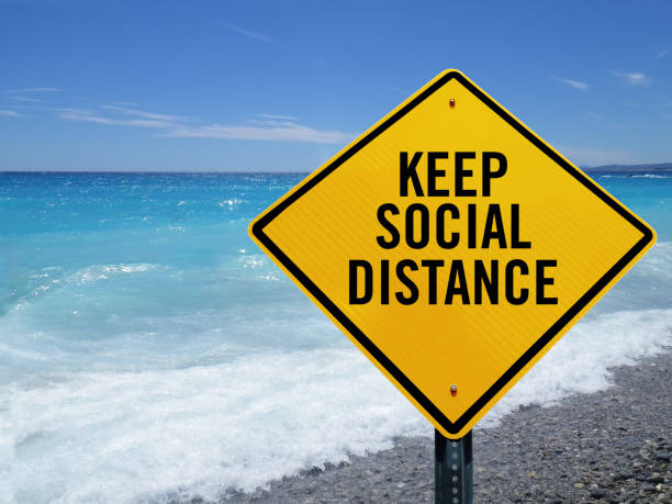 istock Keep social distance sign on beach 1214146236