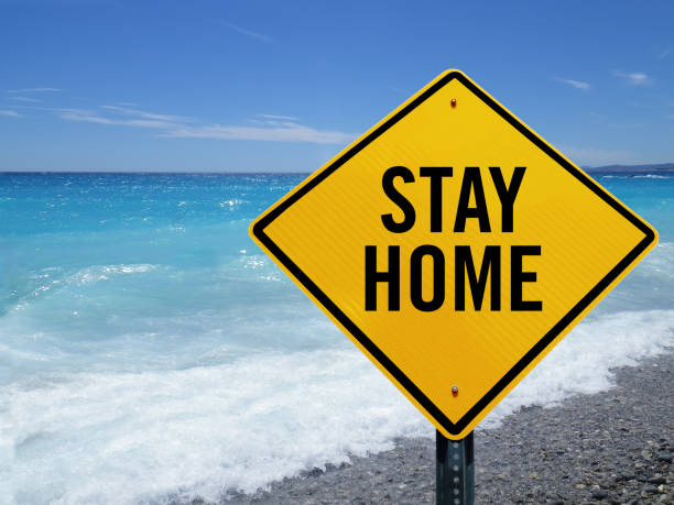 istock Stay home sign on beach 1214147093