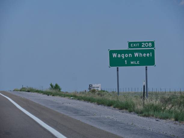 istock Directional signs on the highway with directions to Wagon Wheel exit in New Mexico. 1214147107