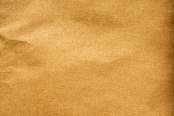 istock Brown crumpled paper recycled kraft sheet texture background 1214148967