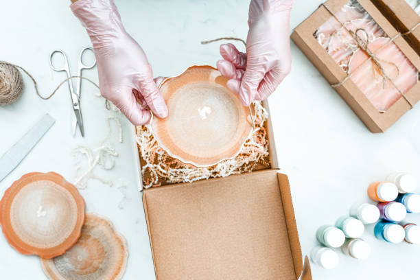 istock Creativity and craft. A young girl creates coasters from resin. Gift wrapping. Decorative packaging. Idea for business. Remote work, work at home. Art coasters. 1214149524