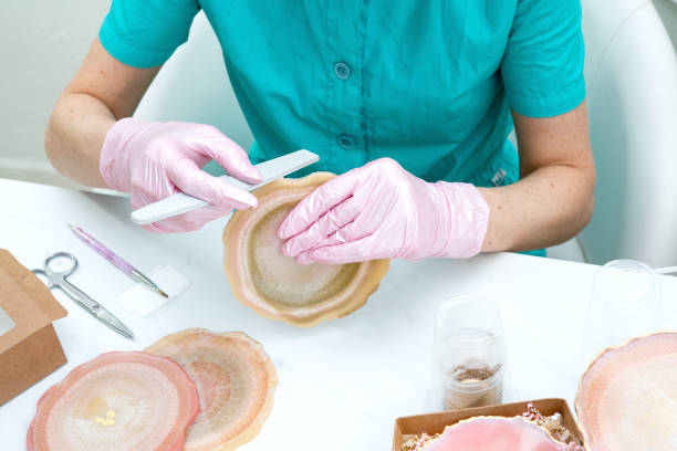 istock Creativity and craft. A young girl creates coasters from resin. Gift wrapping. Decorative packaging. Idea for business. Remote work, work at home. Art coasters. 1214149533