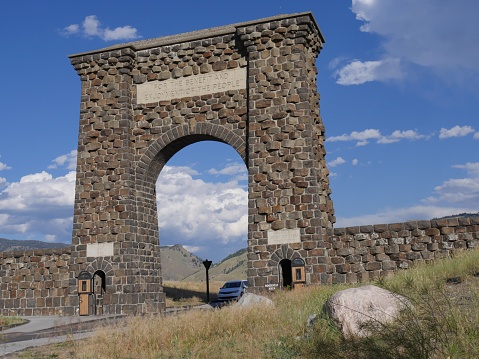 Gardiner, Montana- July 2018: Close up of the stone Roosevelt Arch in Gardiner, the north entrance to Yellowstone National Park.