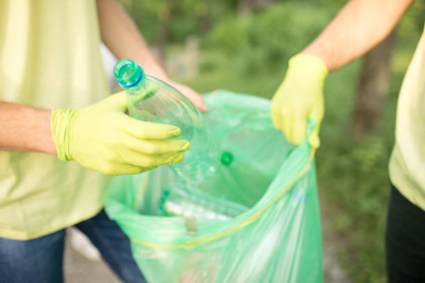 istock A group of young people cleaning up their community. 1214154980
