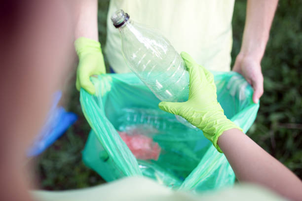 istock A group of young people cleaning up their community. 1214155068