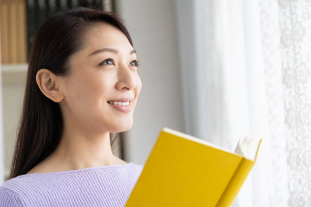 istock asian woman who reads a book 1214157875