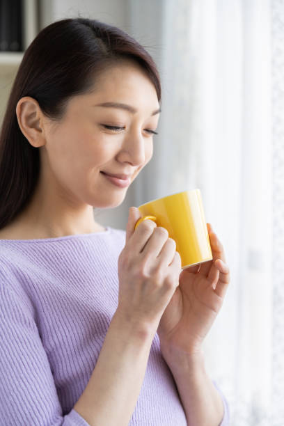 istock asian woman who drink coffee 1214157916