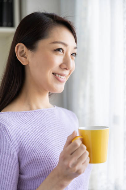 istock asian woman who drink coffee 1214157956