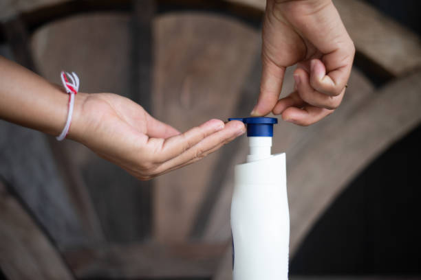 istock Hand using alcohol gel  with protecting coronavirus virus  and bacteria. 1214158654