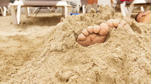 istock Feet in the sand 1214161544