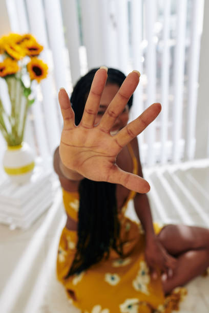 istock Woman covering camera with hand 1214165920