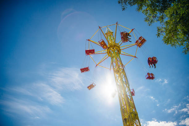 istock Swing Carousel Carnival Ride Set Against a Blue Sky. 1214173006