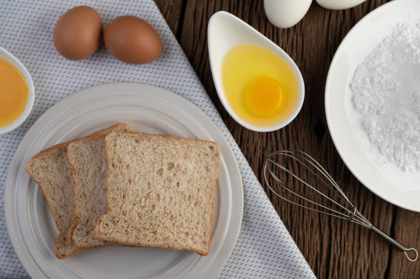 istock Eggs, bread, tapioca flour and an egg beater, ingredients used in bakery 1214173193