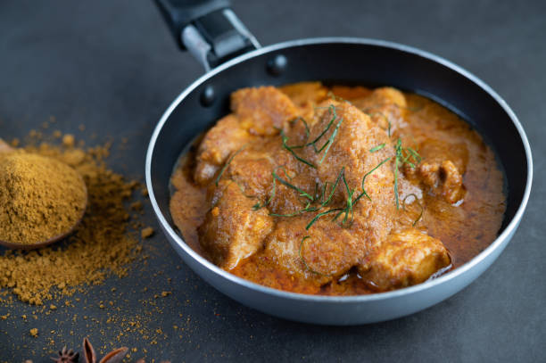 istock Massaman curry in a frying pan with spices on the cement floor. Selective focus 1214177714