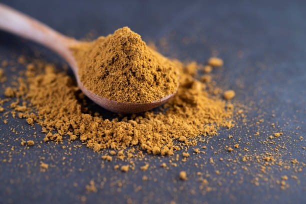 istock Spices are placed in a spoon and placed on the cement ground. Selective focus 1214177715