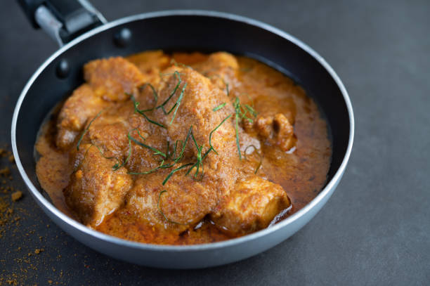istock Massaman curry in a frying pan with spices on the cement floor. Selective focus 1214177739