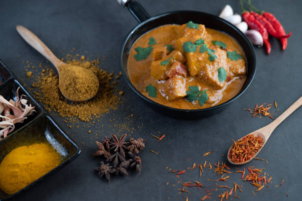 istock Massaman curry in a frying pan with spices on the cement floor. Selective focus 1214177749
