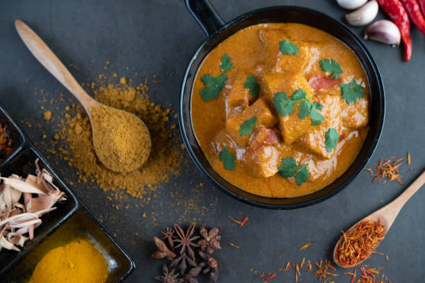 istock Massaman curry in a frying pan with spices on the cement floor. Selective focus 1214177769