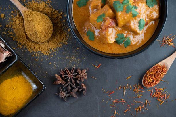 istock Massaman curry in a frying pan with spices on the cement floor. Selective focus 1214177816