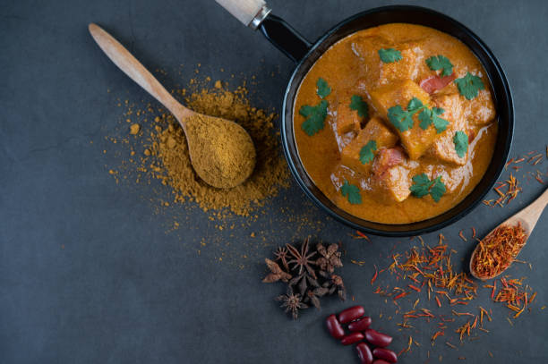 istock Massaman curry in a frying pan with spices on the cement floor. Selective focus 1214177818