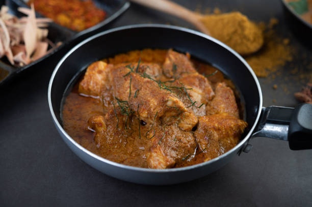 istock Massaman curry in a frying pan with spices on the cement floor. Selective focus 1214177876