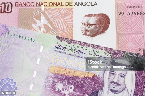 Colorful Currency From Angola With Saudi Arabian Money Stock Photo - Download Image Now