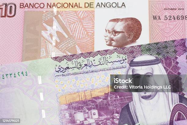 Colorful Currency From Angola With Saudi Arabian Money Stock Photo - Download Image Now