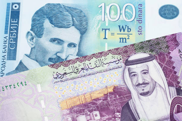 istock A Serbian dinar note with a Saudi Arabian riyal note 1214179425