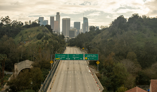 A Los Angeles freeway that usually has bumper-to-bumper traffic eerily sits empty as people are staying home during the Covid-19 pandemic of 2020.