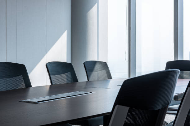 istock Modern office meeting room table and chairs 1214181926