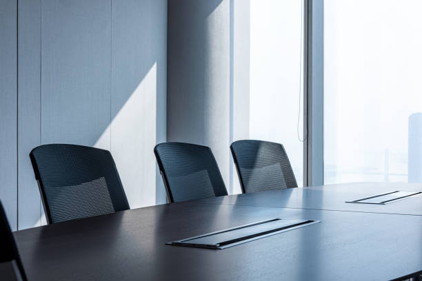 istock Modern office meeting room table and chairs 1214181967