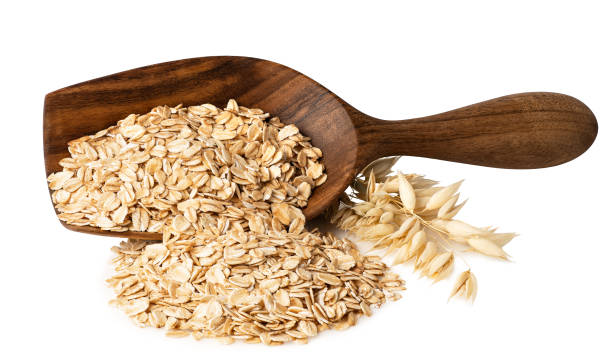 fiocchi d'avena in scoop di legno - oat oatmeal rolled oats oat flake foto e immagini stock