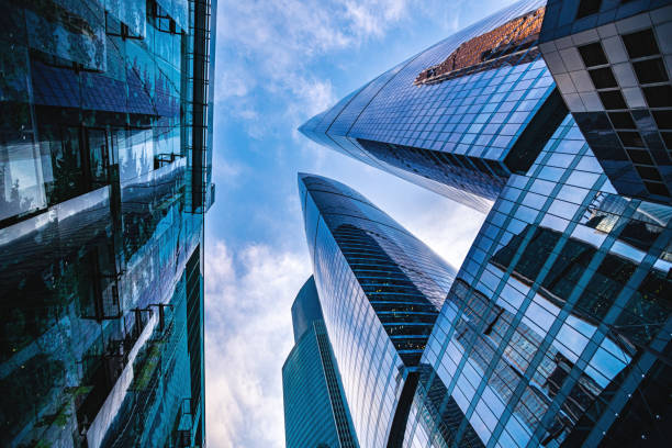 istock Corporate business building against blue sky 1214195138