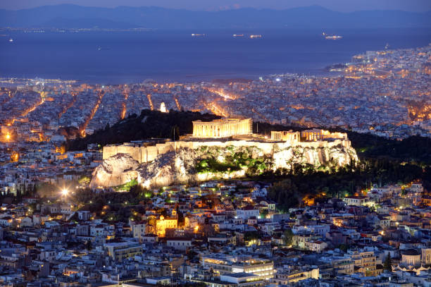 istock Athens skyline panorama with Acropolis in Greece from peak Lycabettus at night 1214196358
