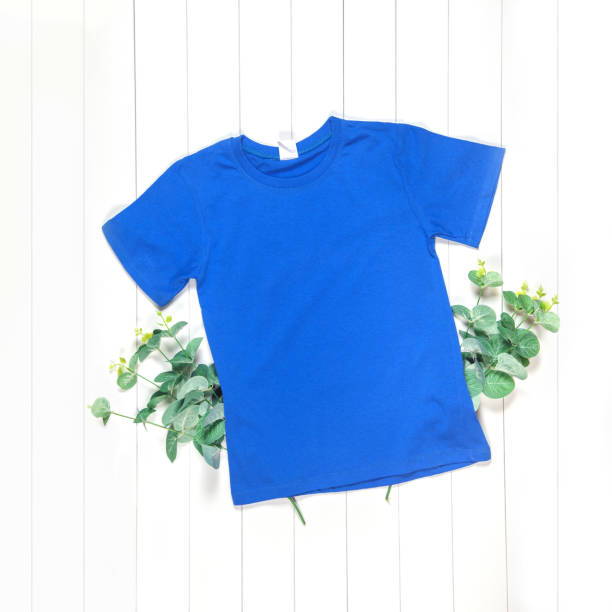 istock Blue T-shirt with green branches to demonstrate your design 1214198357